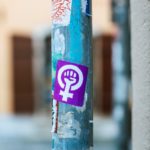 street pole with colorful stickers